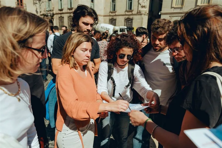 A team huddled together working out a clue