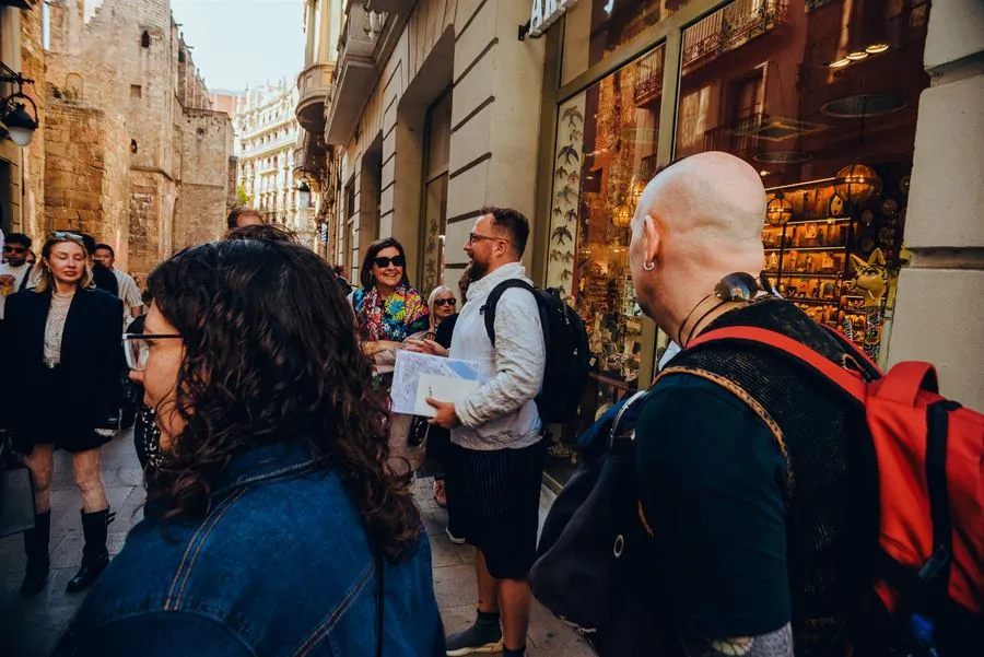 A participant reviewing the clue sheet on the street