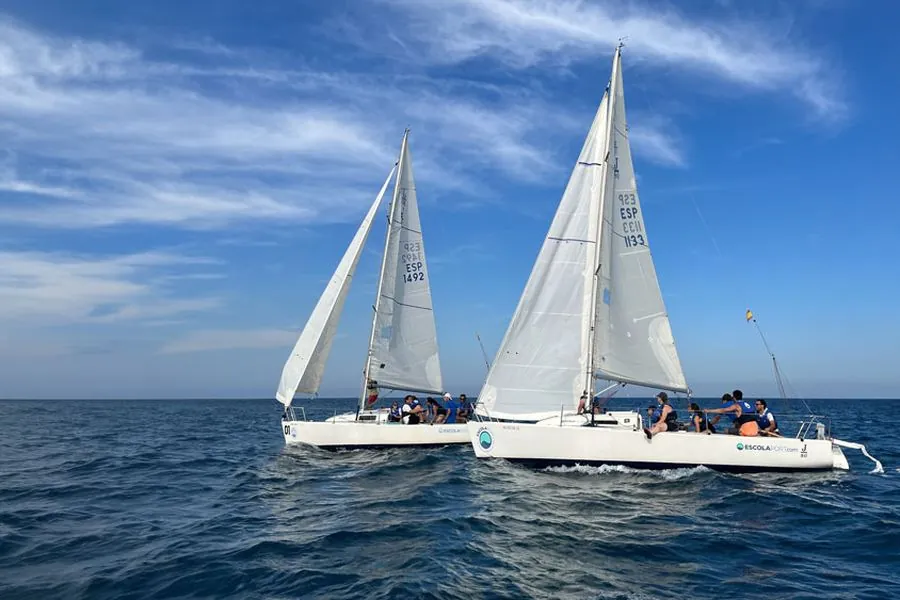 Corporate team sailing a regatta off Barcelona's Port Olímpic